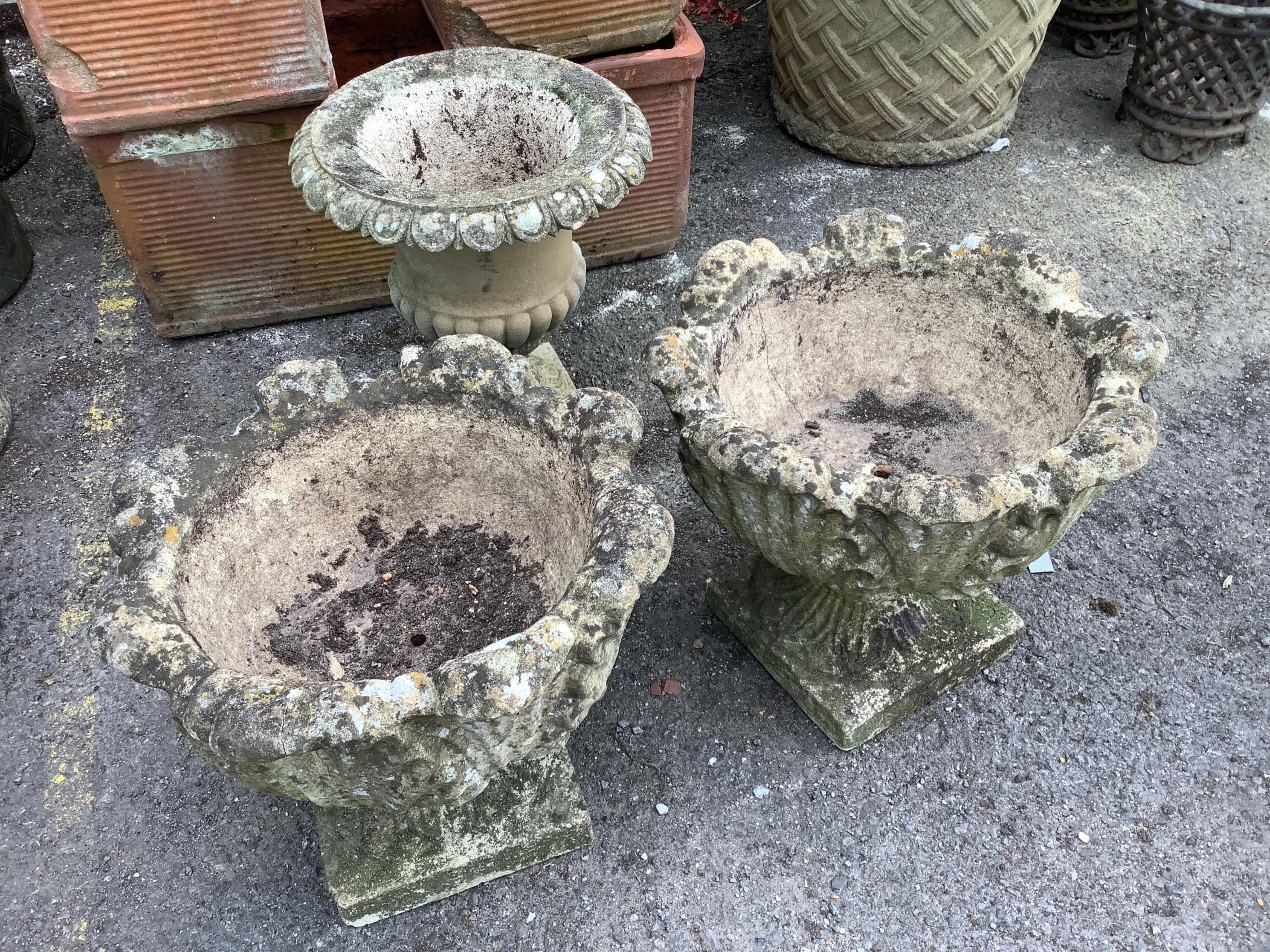 A pair of garden urns and another, larger diameter 46cm, height 40cm. Condition - fair